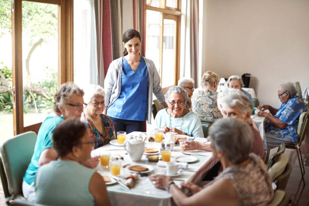 shot of a group of seniors enjoying breakfast together in their retirement home
